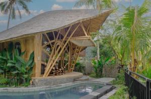 a gazebo with a pool in front of a house at Panorama Sidemen in Silebeng