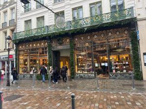 a store on a street with people walking in front of it at Studio Mookaite in Lille