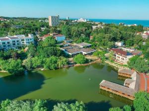 an aerial view of a lake in a city at Hotel Del Mar Venus in Venus