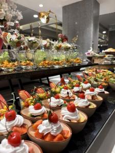 a buffet line of appetizers and desserts in bowls at Mayfair Heritage in Puri