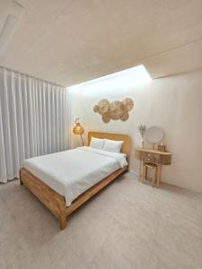 a bedroom with a large bed and a table at La Solis in Incheon