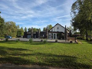 a building with a park in front of it at Brauhaus am See in Oberthulba