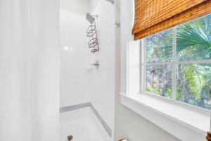 a bathroom with a shower and a window at Blue Sky Bungalow 156 in Seagrove Beach +38 photos