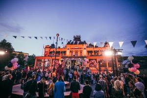 a crowd of people standing in front of a building at Backstage Hotel Stockholm in Stockholm