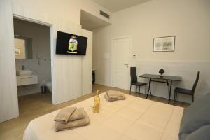 a living room with a table and a dining room at B&B Costa degli Dei in Tropea