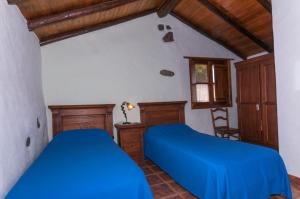 Las Calas de Vallesecoにあるベッド