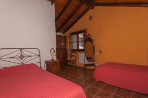 Ένα ή περισσότερα κρεβάτια σε δωμάτιο στο Las Calas de Valleseco