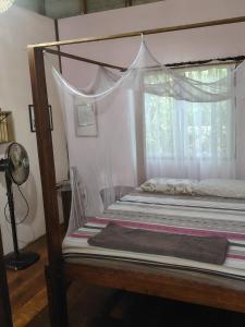a bedroom with two bunk beds with a window at Tampat do Aman in Kudat +79 photos