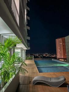a view from the balcony of a building with a swimming pool at Yugen Studio in Davao City