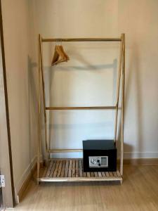 a room with a shelf with a microwave on it at Tree Space Lanta Pool Stay Quiet & Near Beach in Ko Lanta