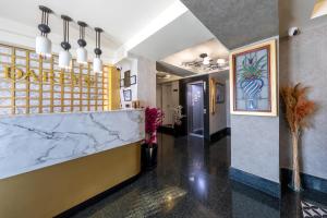 a lobby of a restaurant with a marble counter at Dareyn Boutique in Istanbul