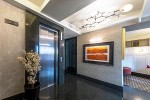 a hallway with a painting on the wall at Dareyn Boutique in Istanbul +47 photos