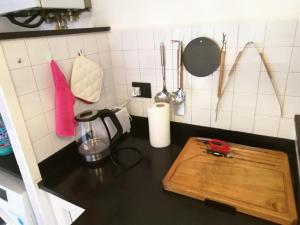 a kitchen with a cutting board on a counter at Antico Mulino in Imperia