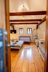 a large room with two beds and a couch at V Údolí in Jablonné v Podještědí