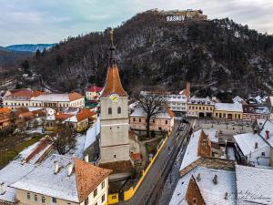 an aerial view of a town with a clock tower at Mountain View Apartment&Parking in Râşnov