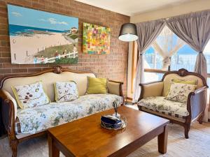 a living room with a couch and a table at Unit 4 - Stawell, Golden Patch Retreat in Stawell