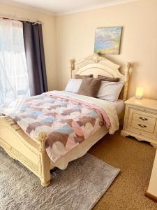 a bedroom with a large bed and a window at Unit 4 - Stawell, Golden Patch Retreat in Stawell