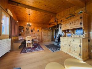 a dining room with a table in a cabin at Chalet Marguerite in Flums