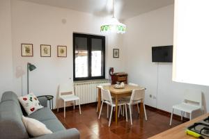 a living room with a couch and a table at Sila Magico Incanto in Camigliatello Silano