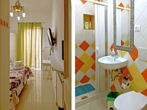 two pictures of a bathroom with a sink and a room at Il Veliero B&B in Gaeta