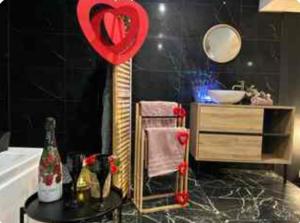 a bathroom with a table with a heart on it at Saphir in Plouray