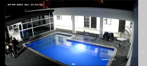 an overhead view of a swimming pool in a building at The Bright Guest House in Pretoria