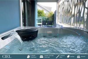 a jacuzzi tub with a water fountain at Cote Ouest in Sévrier +43 photos