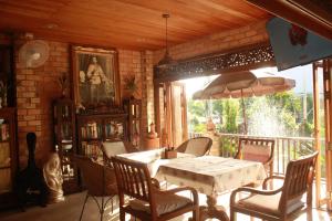 a dining room with a table and chairs at Sea Pines & Liberg in Nai Yang Beach