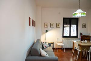 a living room with a couch and a table at Sila Magico Incanto in Camigliatello Silano