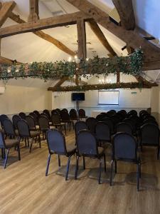 a room with a bunch of chairs in it at Kings Court Hotel Alcester, BW Signature Collection in Stratford-upon-Avon