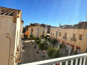 a view from a balcony of a street with buildings at Apartaments IRI in Pineda de Mar