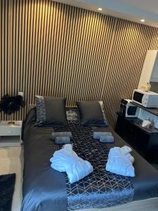 a bed with towels on it in a room at Bentley studio in Sanary-sur-Mer +21 photos