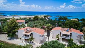 an aerial view of a house with the ocean in the background at Sunset Beach Appartments in Minia