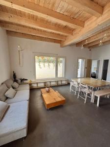 a living room with a couch and a table at El Santo Hostel in Burgos