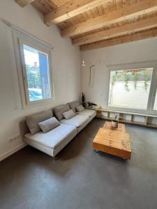a living room with a couch and a coffee table at El Santo Hostel in Burgos +193 photos