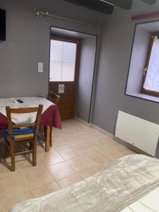 a room with a table and chairs and a window at Gite de Sainte Gemme in Sainte-Gemme