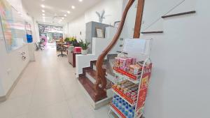 a store with a aisle with food on display at HT Airport Inn in Phù Xá Ðoài
