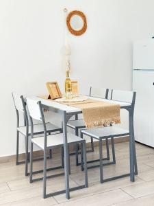 a dining room table and chairs with a table and a table and chairsktop at First Love in Caleta De Fuste +46 photos