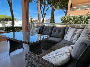 a living room with a couch and a glass table at Puig Sa Guilla 1C B2 in Pals