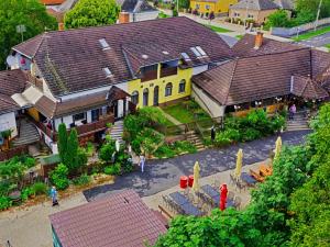 an overhead view of a house with roofs at Fehérló Vendégház & Restaurant in Bük