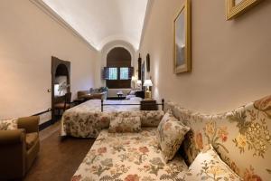 a living room with a couch and a table at Relais Villa Giusso in Vico Equense