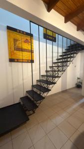 a spiral staircase in a building with a ceiling at Yvyrá Duplex in Eldorado