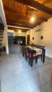 a dining room with a table and chairs at Yvyrá Duplex in Eldorado