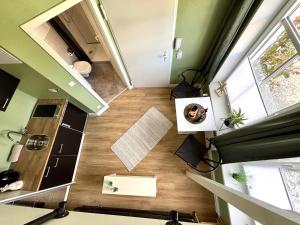 an overhead view of a kitchen and a living room at Haus OstseeWelle - Kleine Perle in Dahme