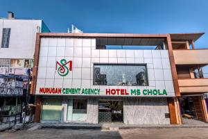 a building with a sign for a hospital at Hotel M S Chola in Chennai