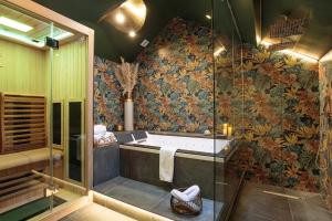a bathroom with a tub and a shower at Maison 1887 in Paris +96 photos