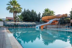 a water slide in a swimming pool at The Gap Hotel Kuşadası in Kuşadası