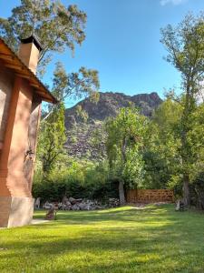 a view of a mountain from the yard of a house at Cabaña Cerro Lindo in San Rafael