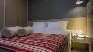 Postel nebo postele na pokoji v ubytování Grande Hotel Ipatinga + 14 fotografií