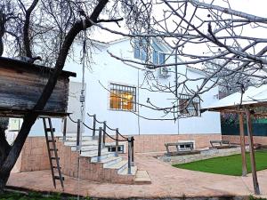 a set of stairs in front of a building at La Villa Blanca in Pedralba